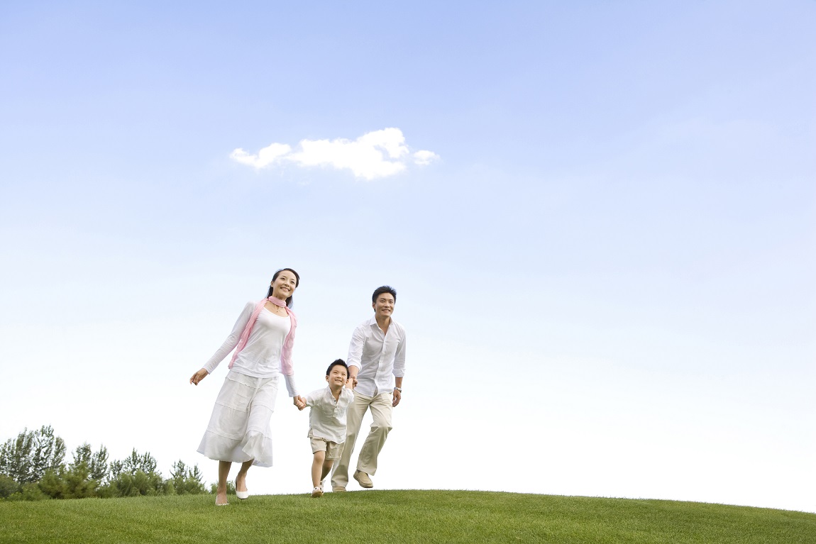 A young family enjoying the park