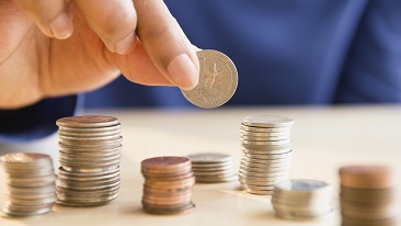 Woman stacking coins